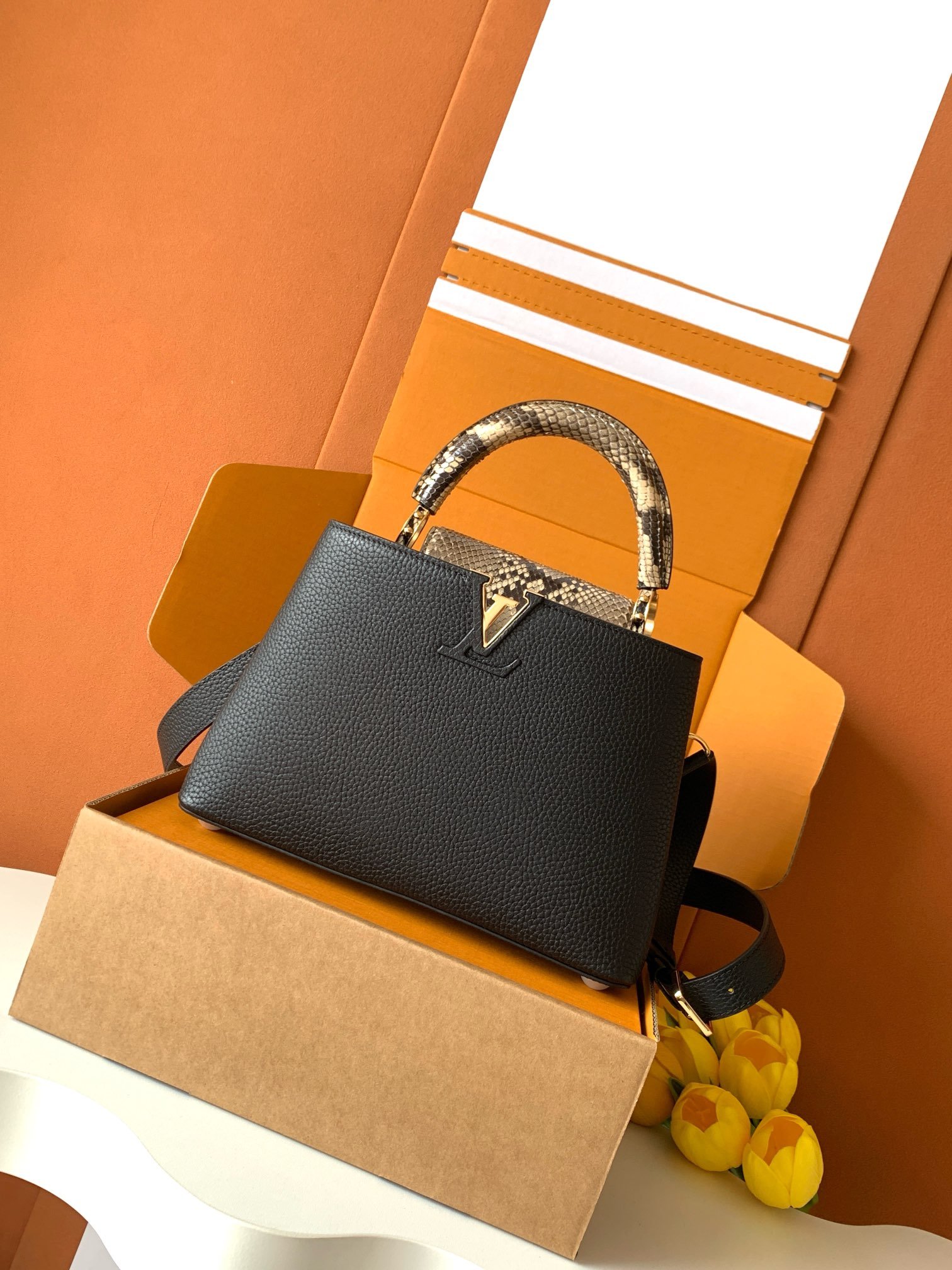 Louis Vuitton black with shiny python gold L92303
