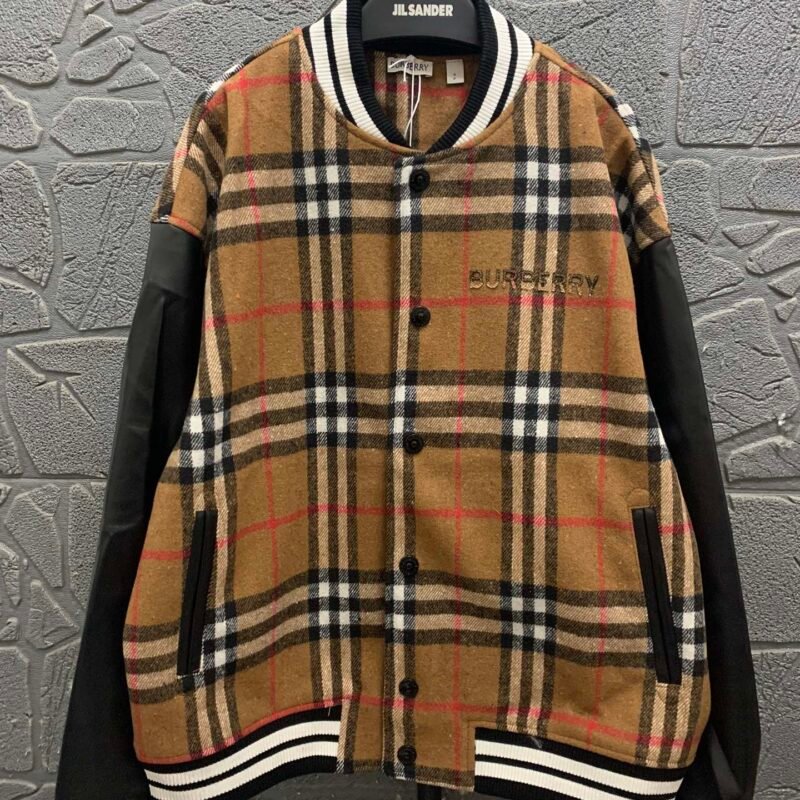 Burberry patchwork knit sweater paired with a baseball jacket featuring spurs-embroidered letter pattern 111210